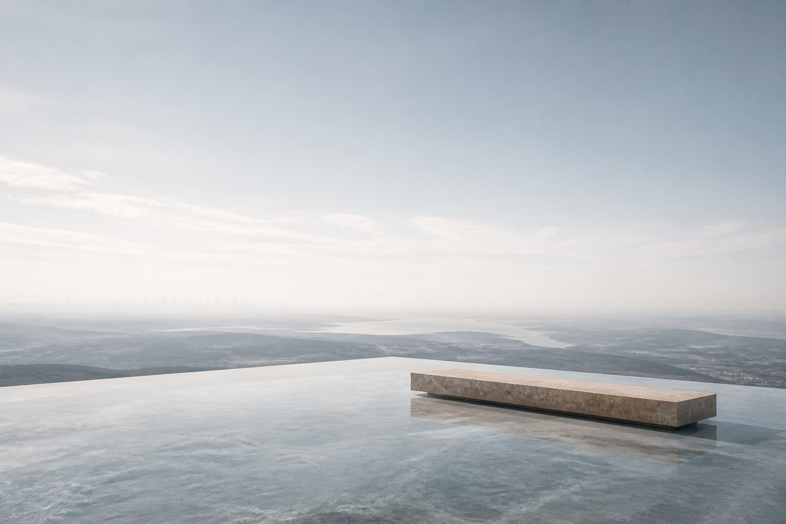 A still lake and a stone bench overlooking a vast misty vista, money at rest.
